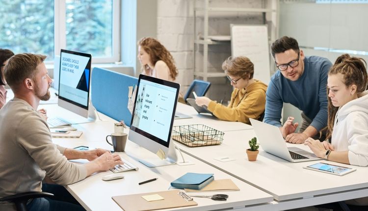 Employees working at a conference table